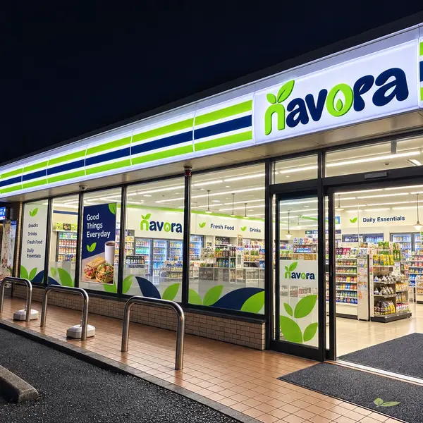 Concept visual: angled exterior view of a Navora convenience store glowing at night.
